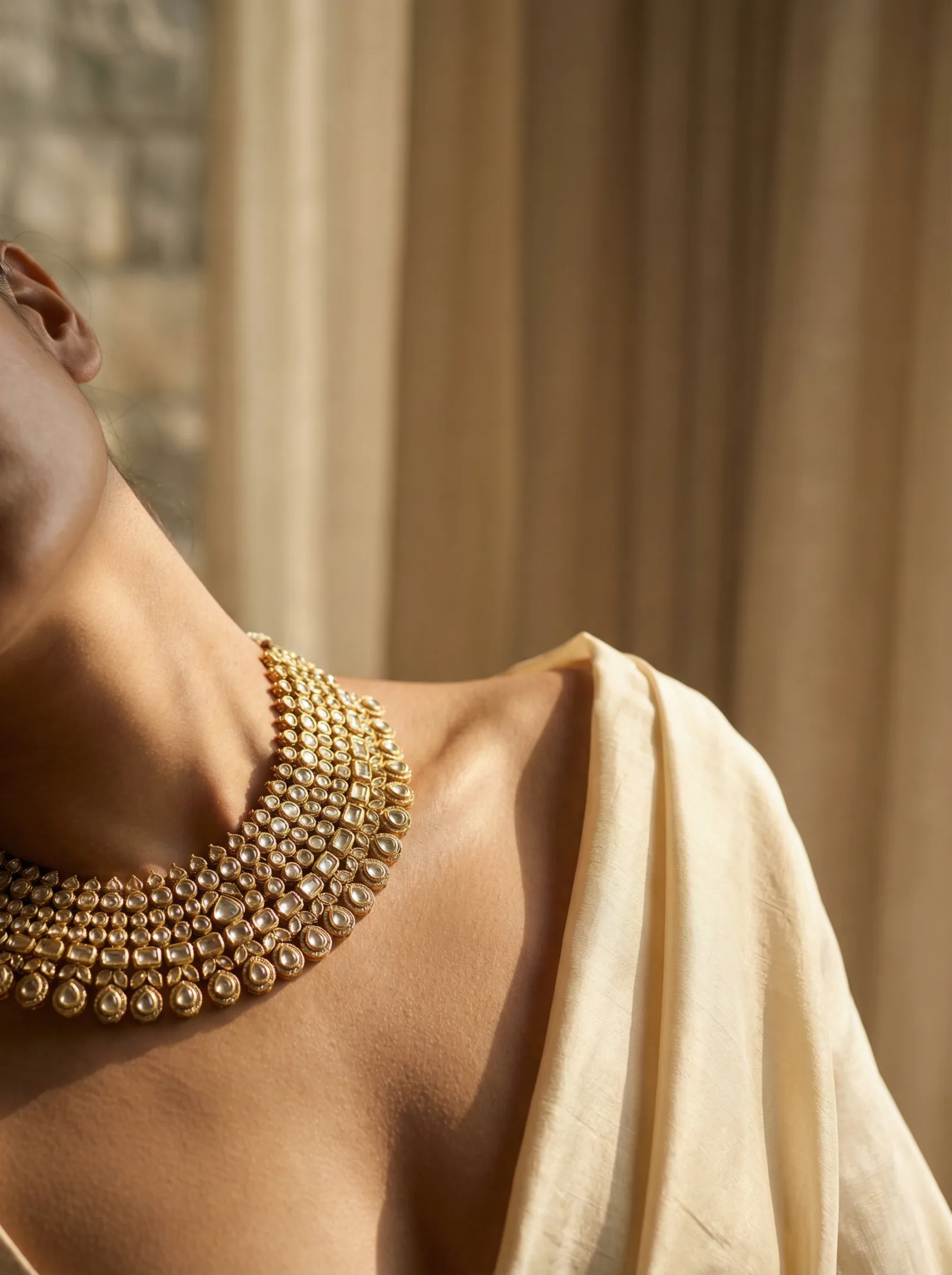 Gold jewellery on warm fabric